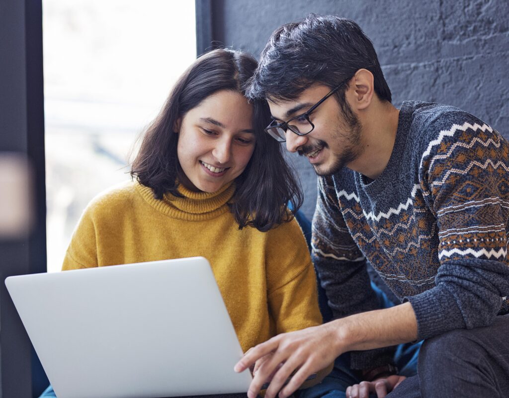 two-colleagues-working-laptop-